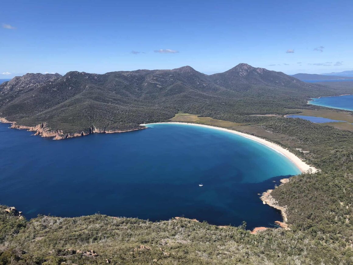 Clear blue waters of Wineglass Bay from the top of Mt Amos in Freycinet National Park, Tasmania