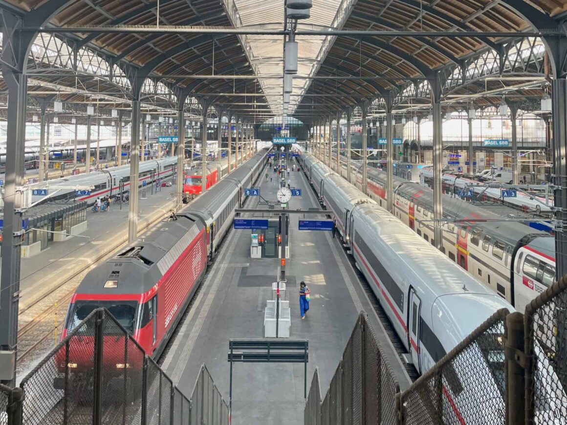 Multiple trains from Germany and Switzerland all parked at the Basel SBB train station