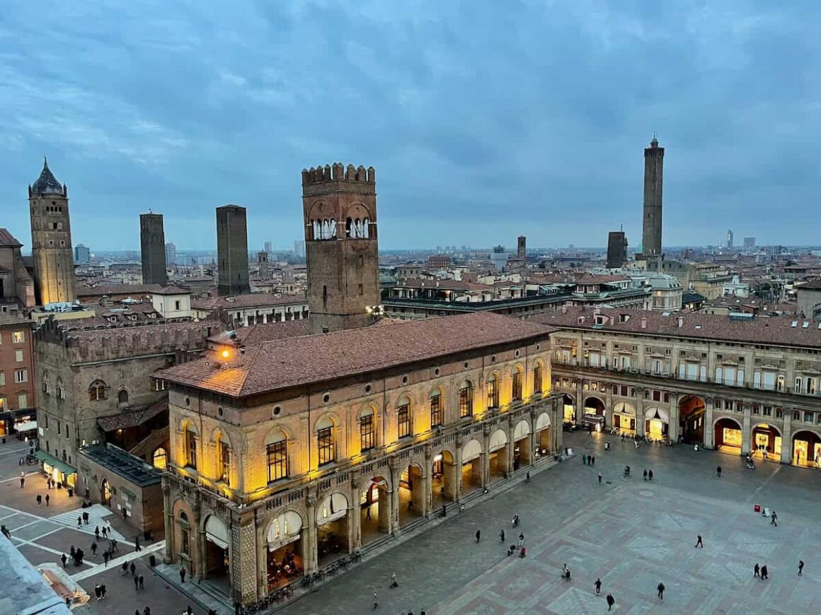 Overlooking Piazza Maggiore in Bologna from Torre dell’Orologio — an easy Eurail stop in Italy