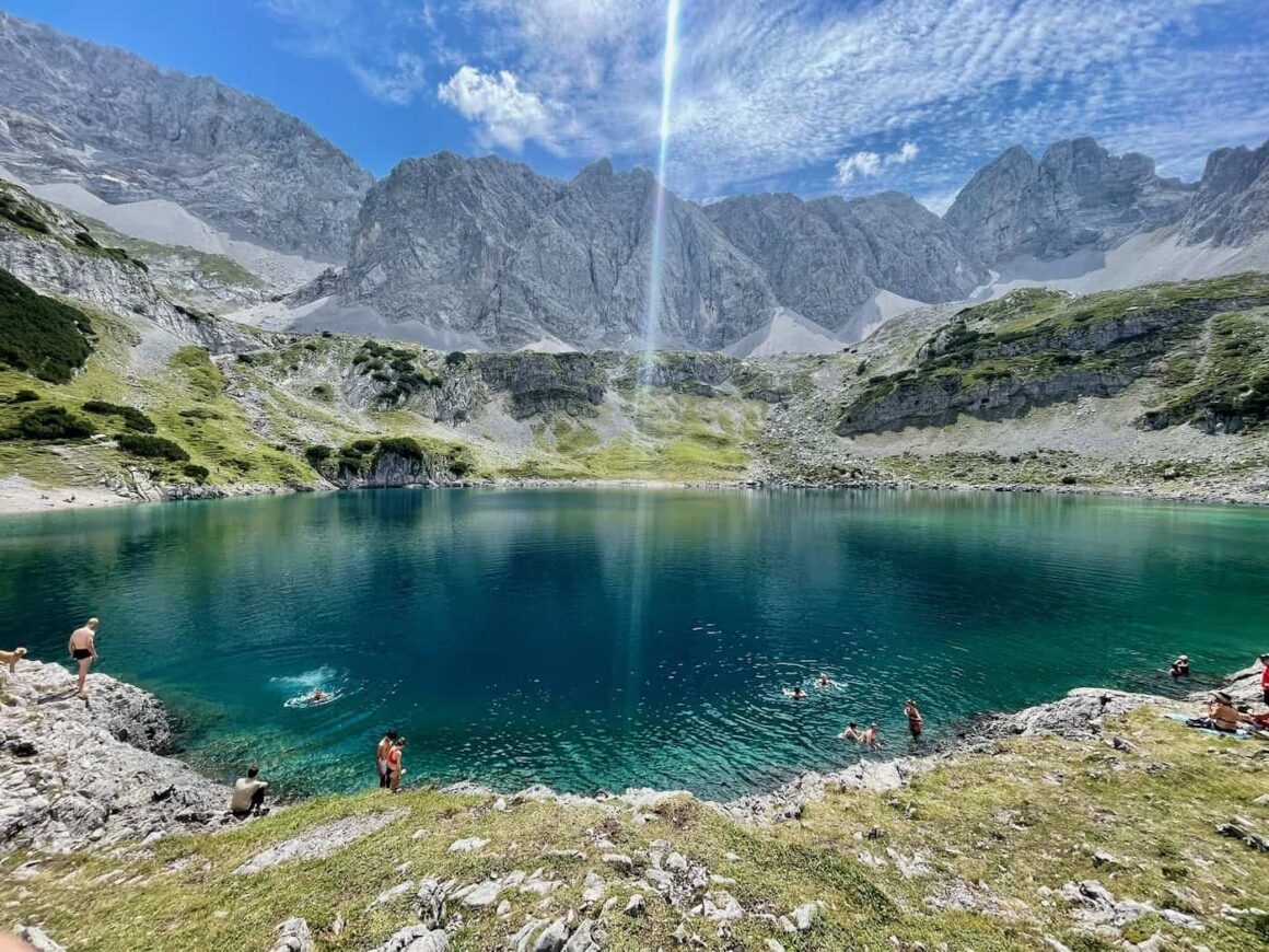 Swimming in the crystal clear Drachensee in the Austrian Alps — perfect summer activity in Western Europe