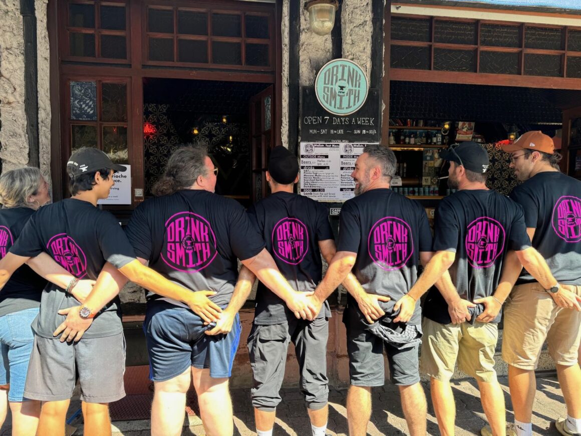 The staff of Drinksmith Neighbourhood Bar at the Brückenwall Strassenfest in Germany — friends from 6 different countries made while travelling