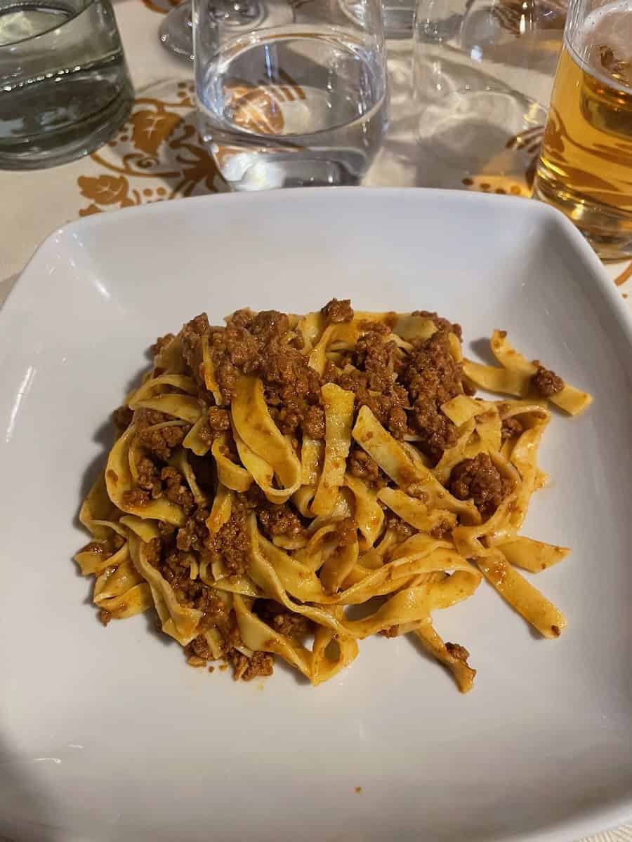 Bolognese pasta at a local restaurant in Bologna, Italy — trying local cuisine is a must when travelling Europe