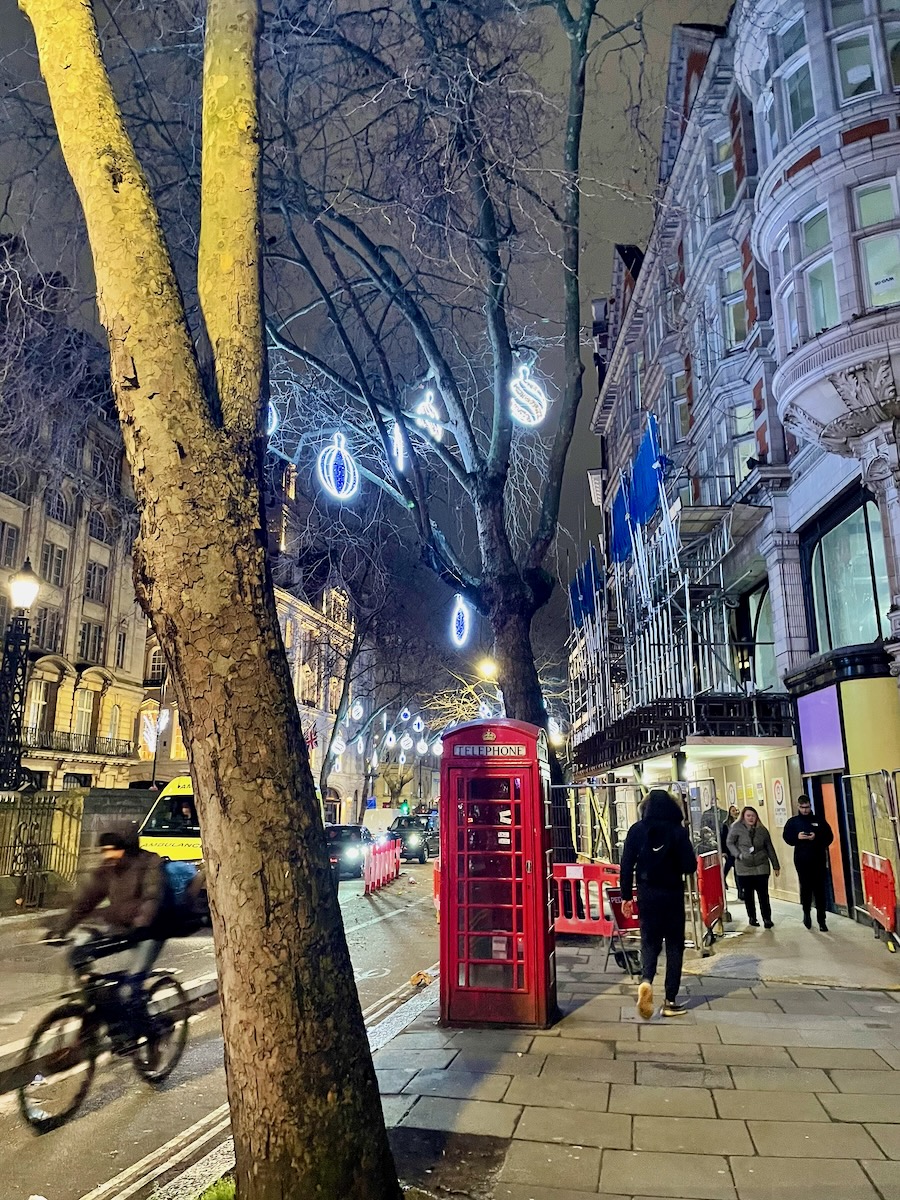 Red phone box on a busy London street — connecting to mobile data in Europe with an eSIM