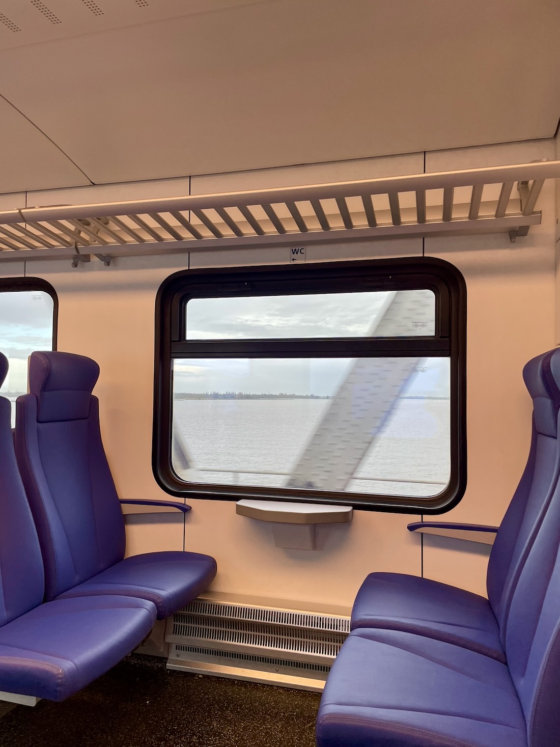 View of the Oude Maas from a local Nederlandse Spoorwegen train in the Netherlands