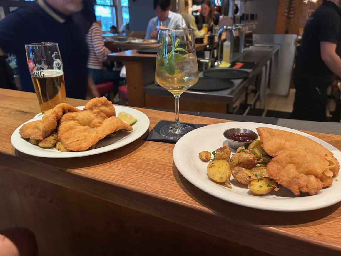 Schnitzel with potatoes and cranberry sauce at a restaurant in Frankfurt — eating out in Germany