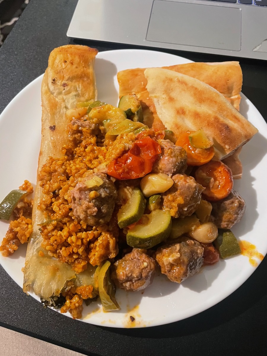 A Too Good To Go surprise bag with Turkish food — a mix of meat, vegetables, pita, and borek for just €4 in Europe